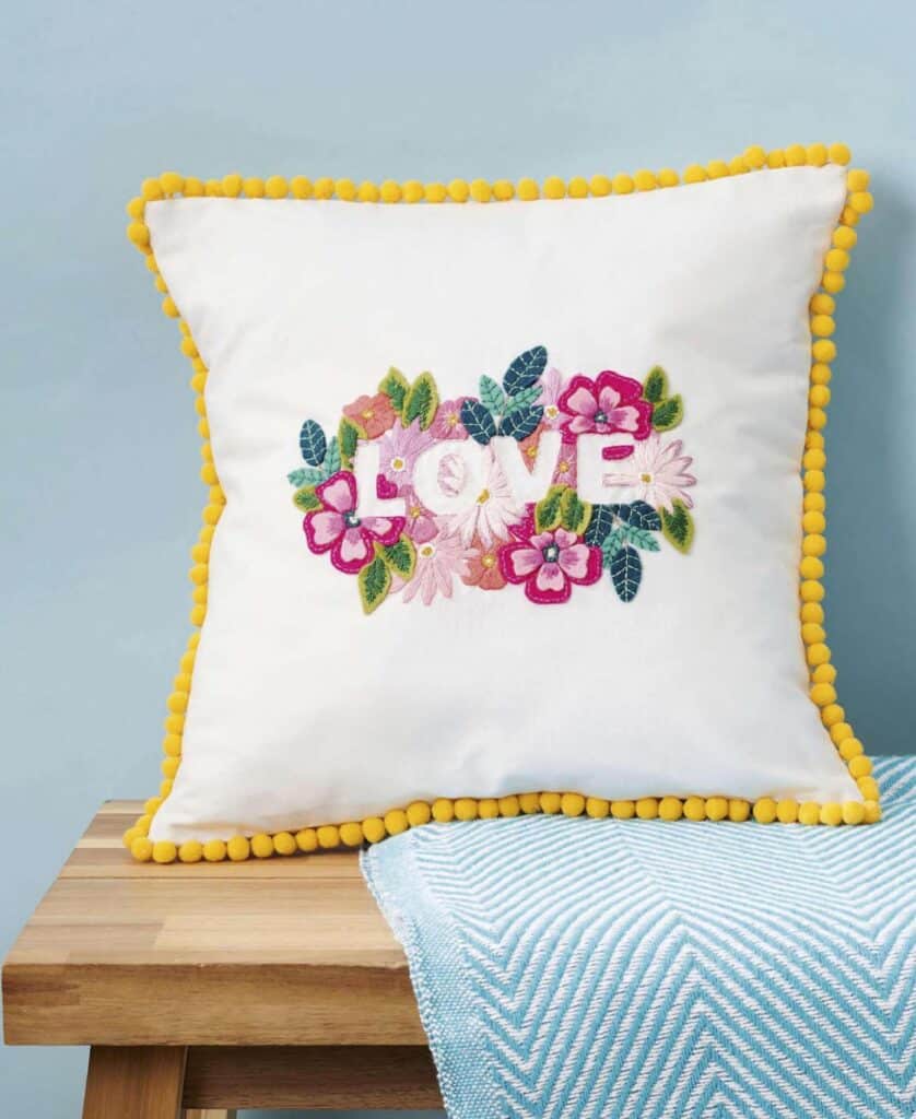 Love-embroidered cushion